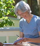 lady journaling at The Expanding Light